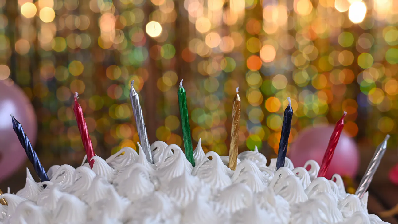 Birthday cake with lit candles