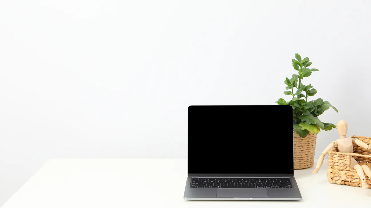Laptop on a clean desk ready for a website review